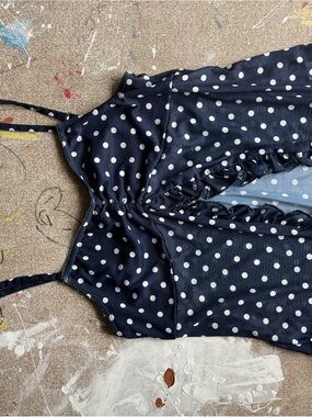 Navy Polka Dot Sleeveless Ruffle Front Top